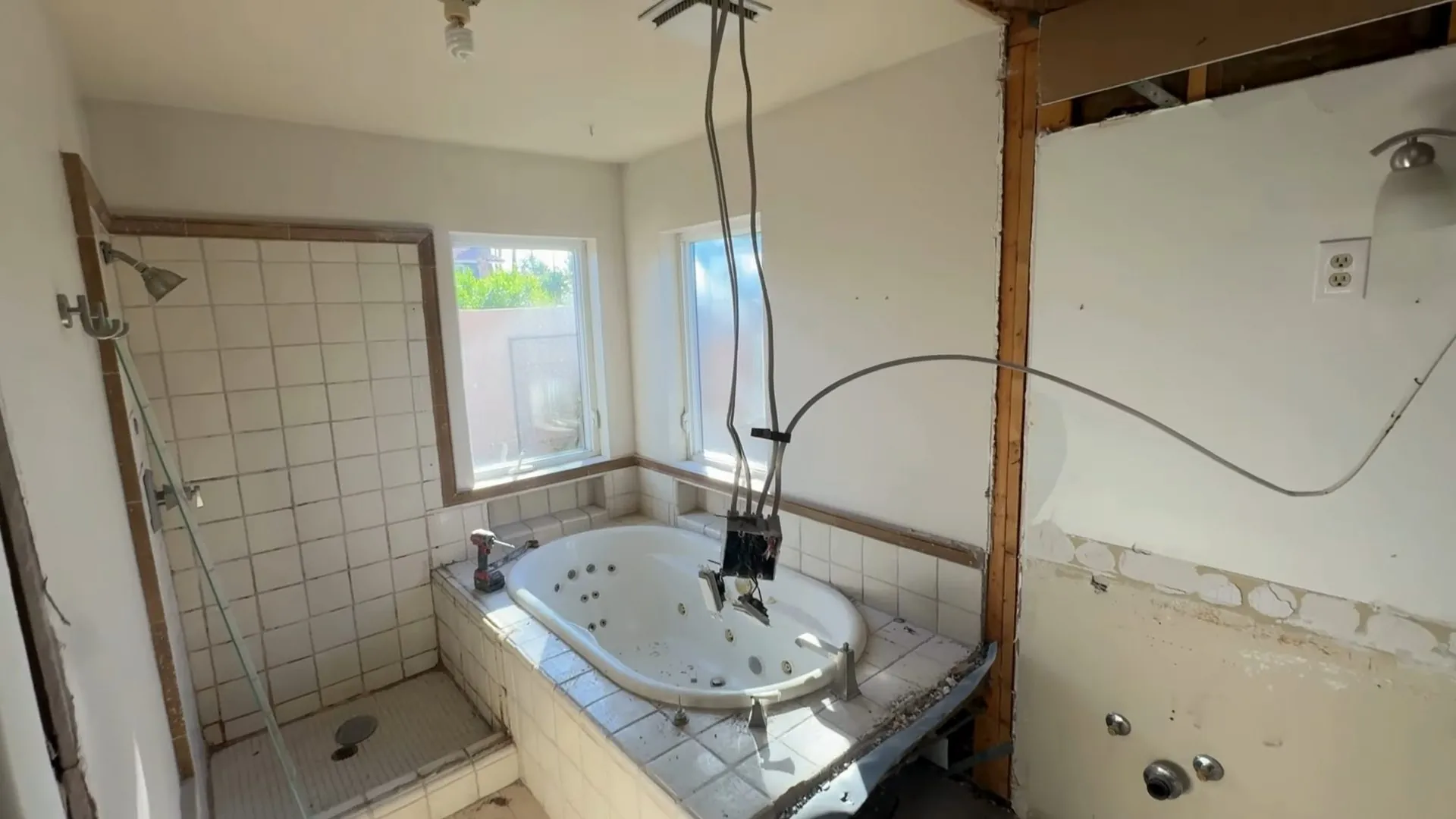 Bathroom with the wall and tub surround opened down to the studs