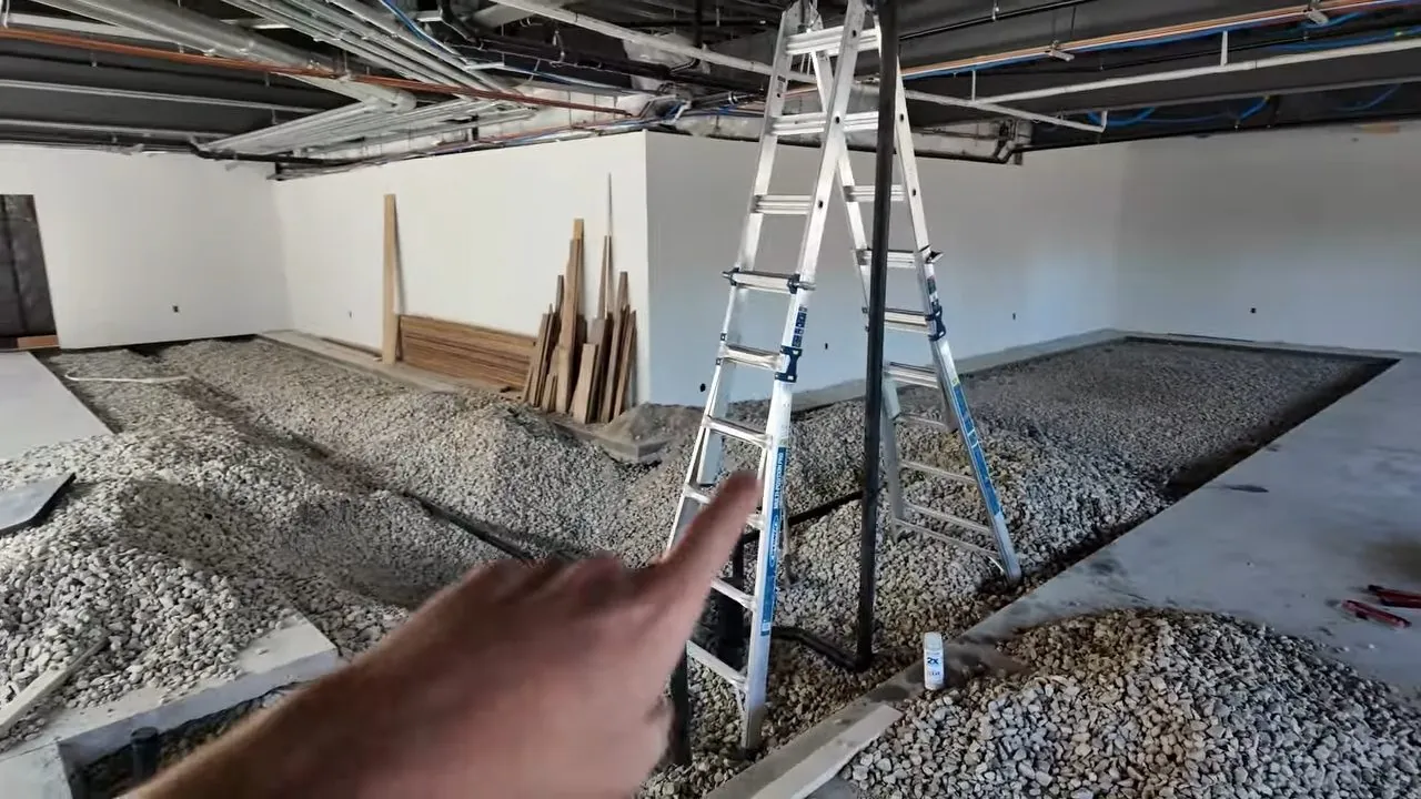 Drain pipe laid in gravel in a commercial space under construction